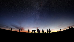 Astronomers looking at the sky