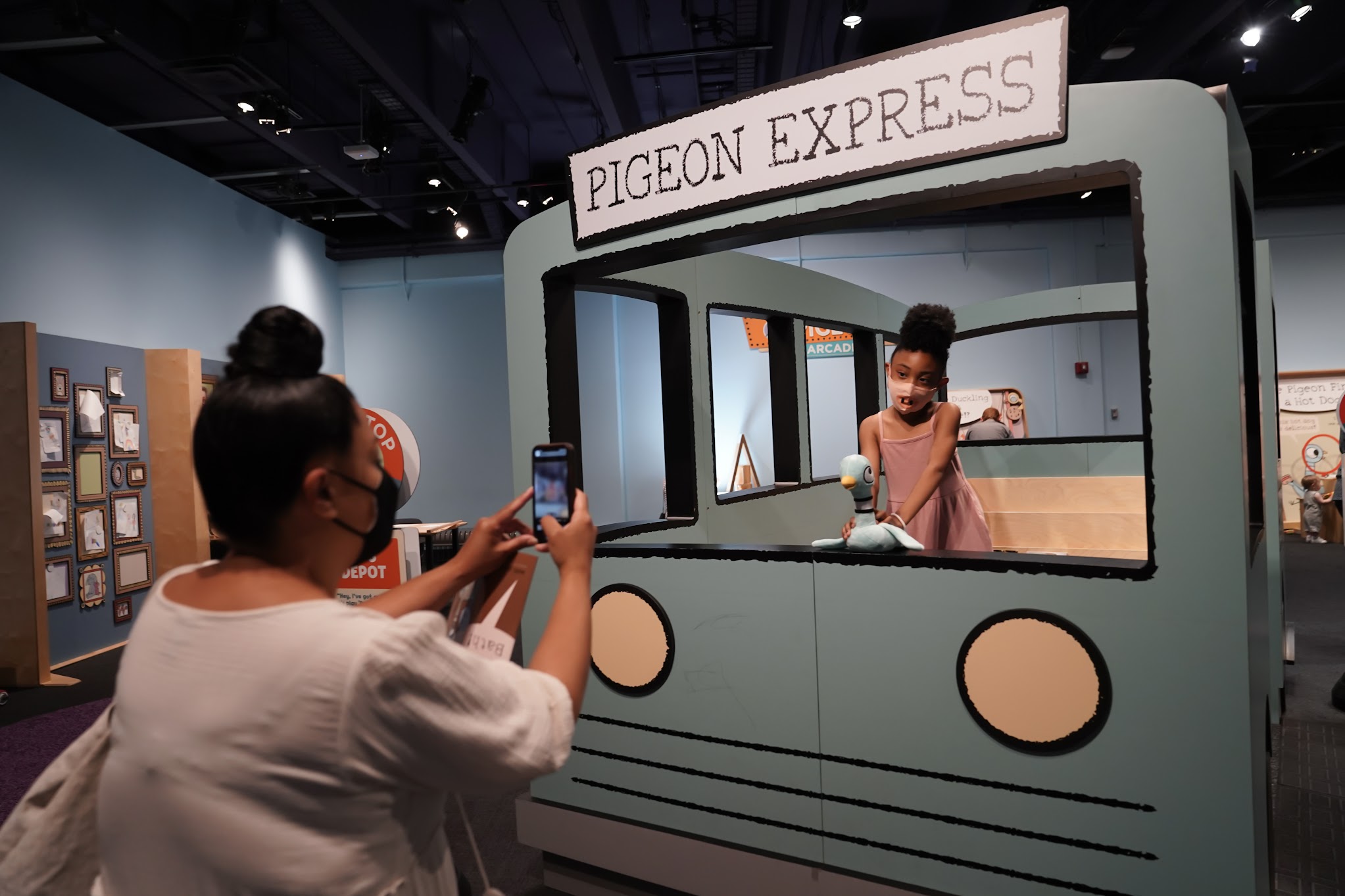 Guests having fun in The Pigeon Comes to Jersey City: A Mo Willems Exhibit