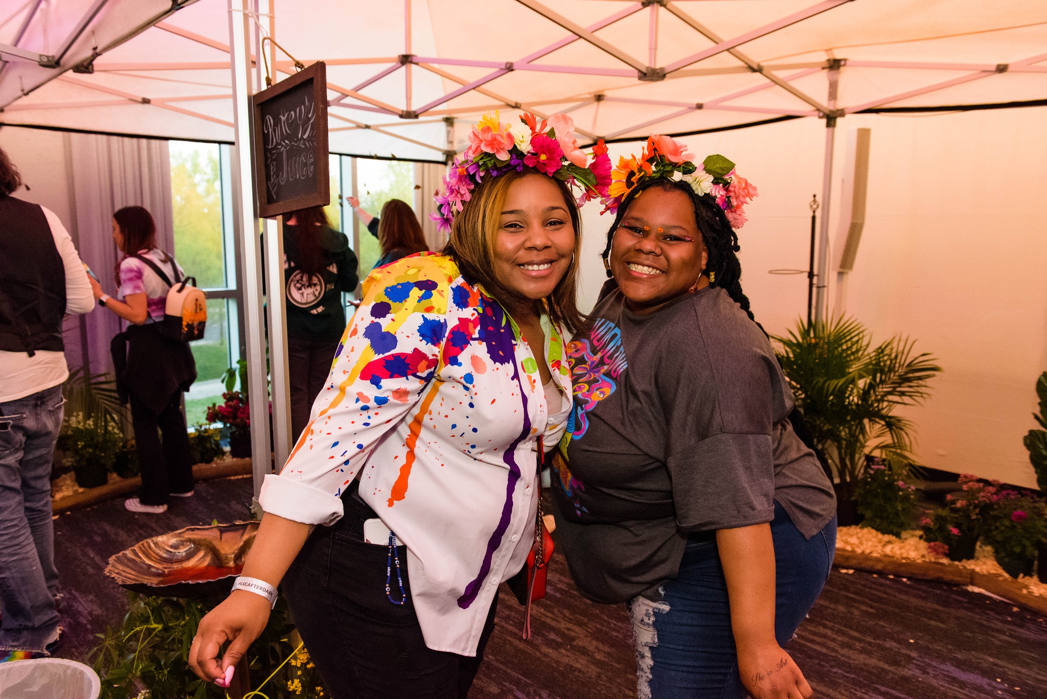 Guests in the Butterfly House at LSC After Dark: Peace, Love & Woodstock