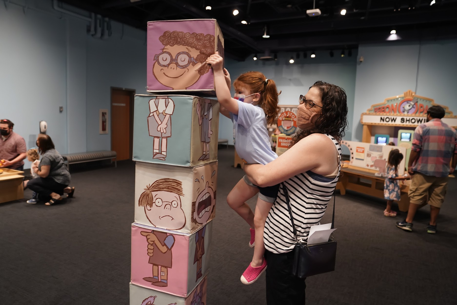 Guests having fun in The Pigeon Comes to Jersey City: A Mo Willems Exhibit
