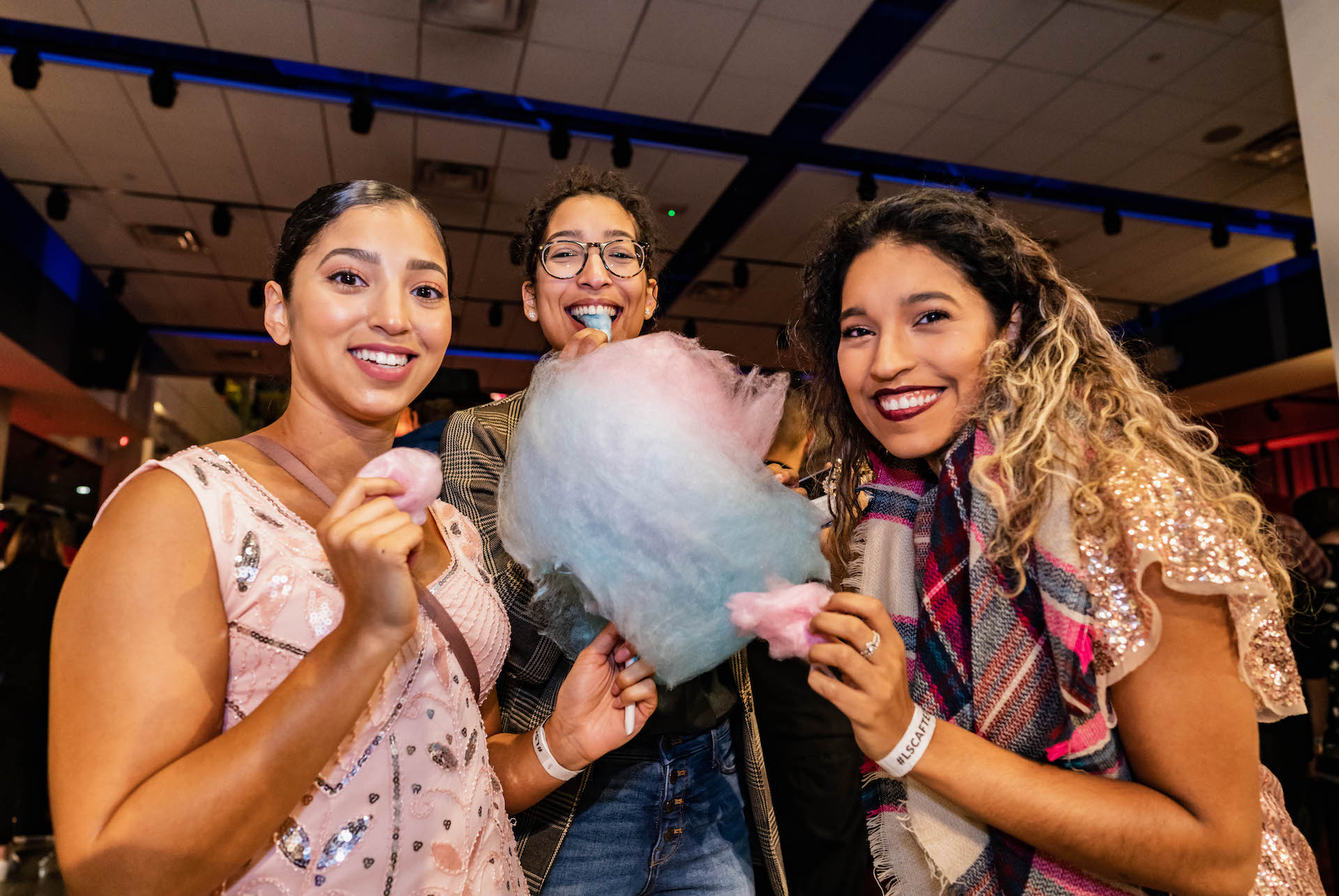 LSC After Dark guests eating cotton candy