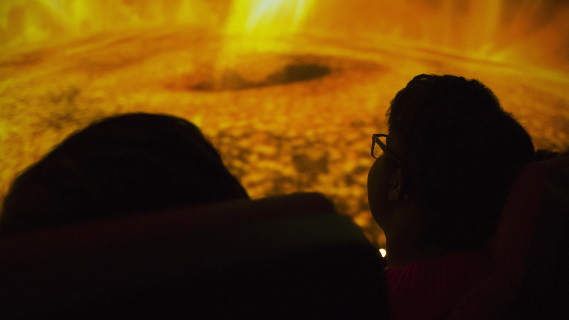 Guests watching show in the Jennifer Chalsty Planetarium