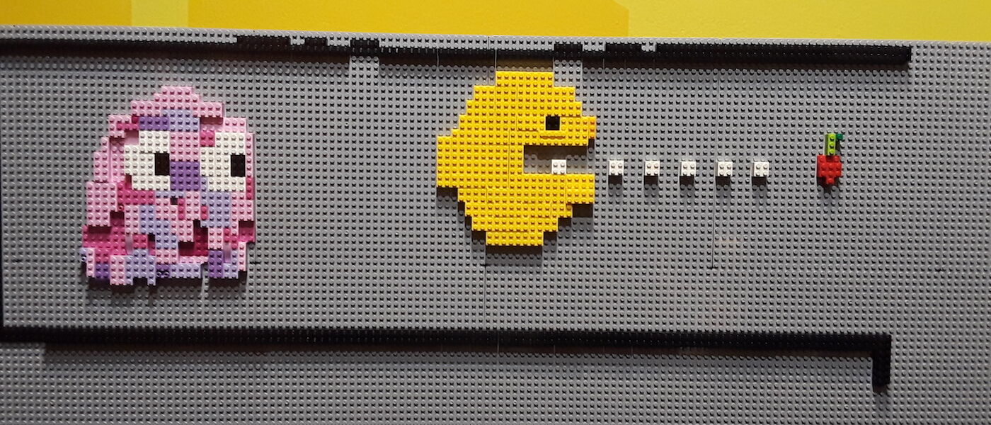 Ghost chasing Pac Man made of LEGO pieces