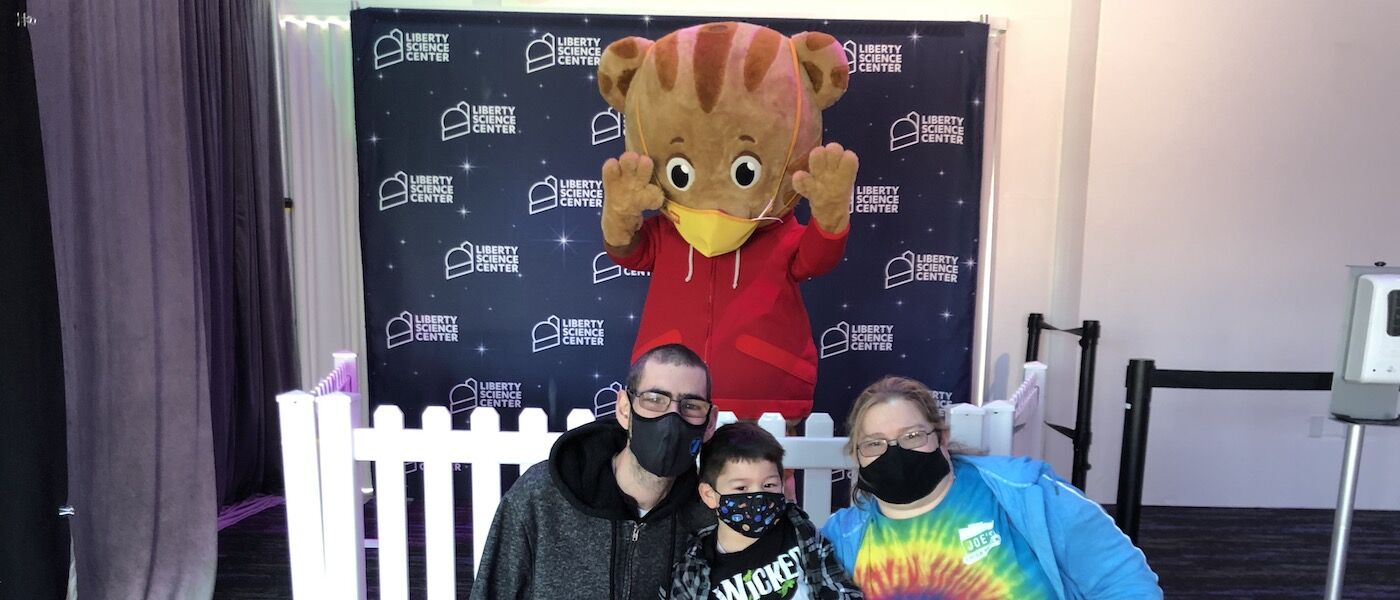 Family with Daniel Tiger costume character
