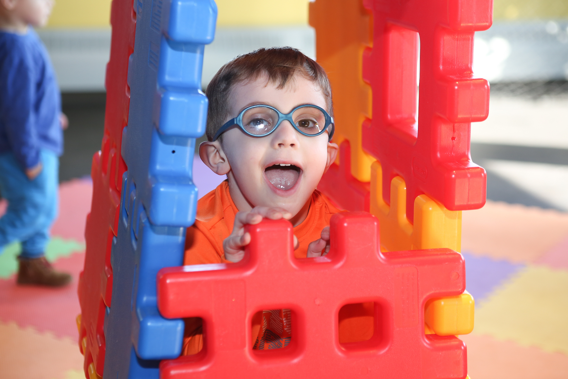 Boy in waffle block structure