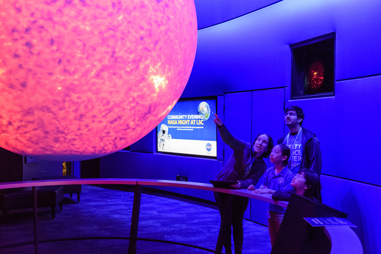 Guests at the Science on a Sphere