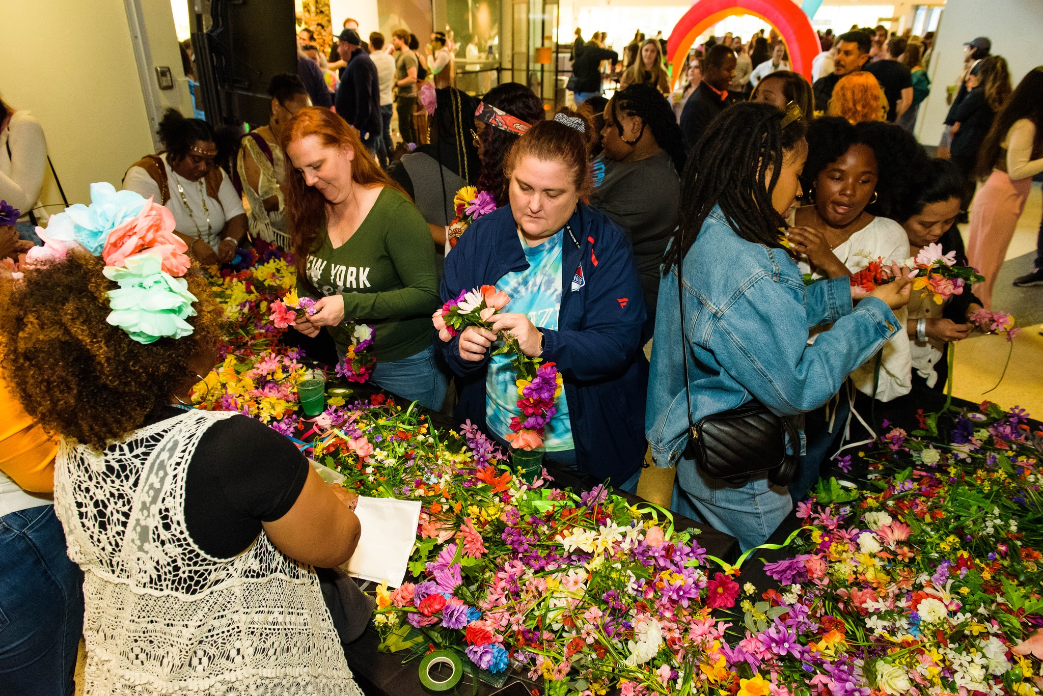 Guests making flower crowns at LSC After Dark: Peace, Love & Woodstock