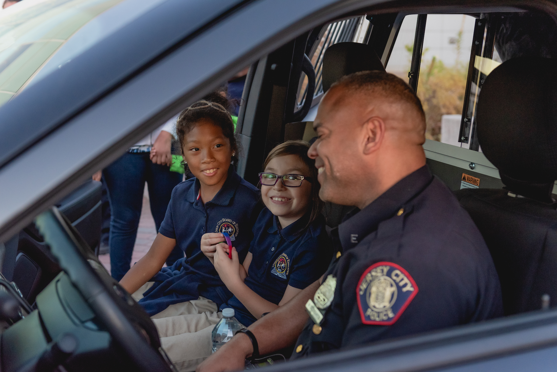 Kids in cop car
