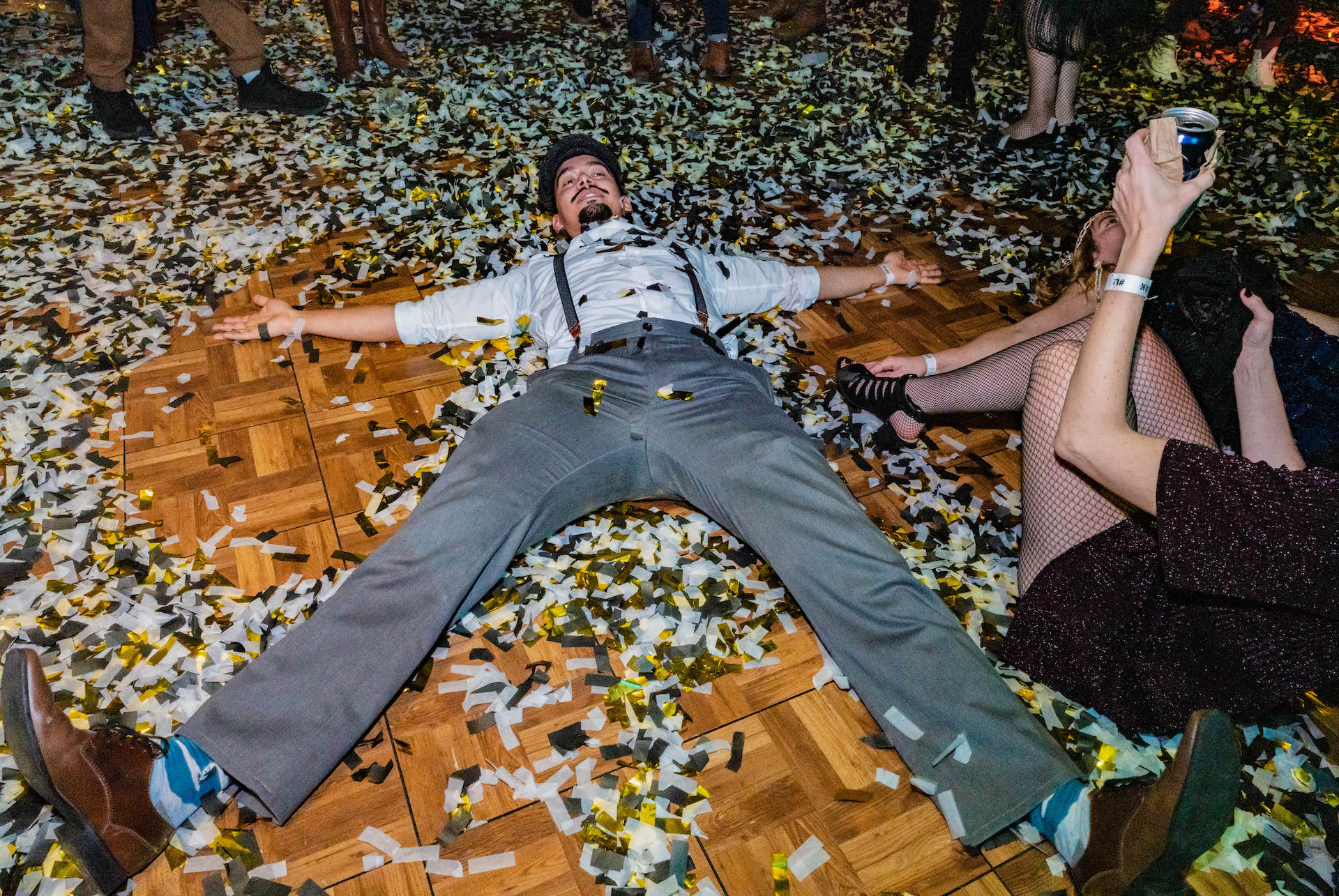 LSC After Dark guest laying in confetti