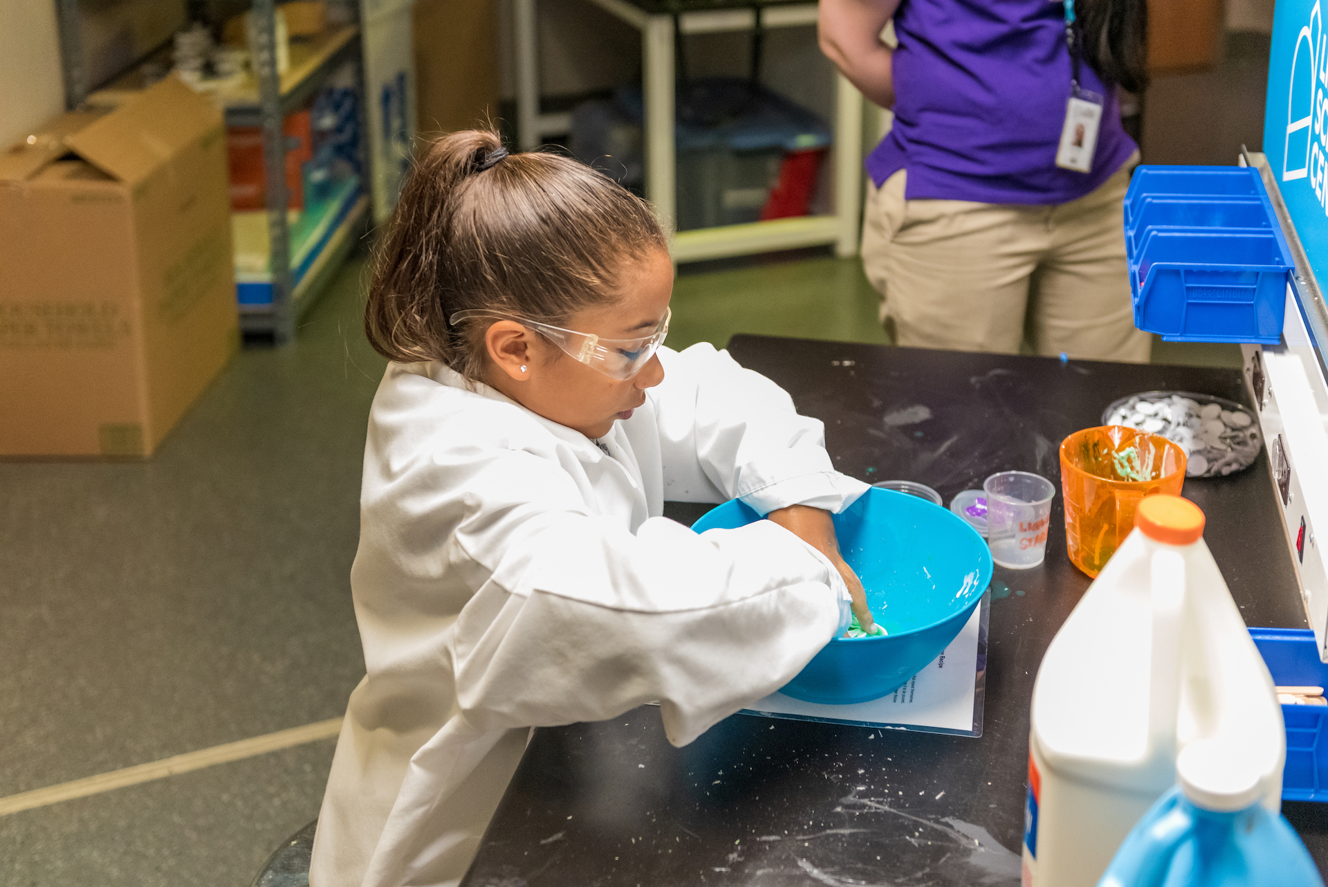 Girl making slime at Slime Lab