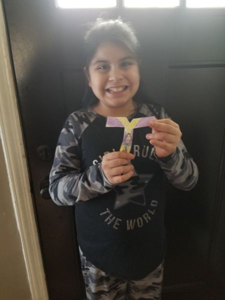 Young girl with maple seed model experiment