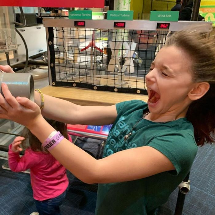12 Days of Science photo contest runner-up (girl having fun in Energy Quest)